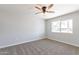 Spacious bedroom with brick accent wall and ceiling fan at 10220 N 109Th Ave, Sun City, AZ 85351