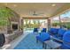 Comfortable patio furniture near fireplace and pool at 3749 E Juniper Cir, Mesa, AZ 85205