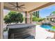 Relaxing hot tub on patio with pool view at 3749 E Juniper Cir, Mesa, AZ 85205