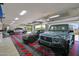 Spacious garage with epoxy flooring, ample storage, and room for multiple vehicles at 3749 E Juniper Cir, Mesa, AZ 85205