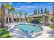Resort style backyard oasis with a large pool and covered patio at 3749 E Juniper Cir, Mesa, AZ 85205