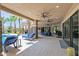 Extensive covered patio with comfortable seating and pool access at 3749 E Juniper Cir, Mesa, AZ 85205