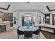 Round dining table with seating for six, overlooking patio at 3749 E Juniper Cir, Mesa, AZ 85205