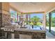 Outdoor kitchen with grill, sink, and cooktop at 3749 E Juniper Cir, Mesa, AZ 85205