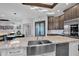 Modern kitchen features a farmhouse sink and granite countertops at 3749 E Juniper Cir, Mesa, AZ 85205