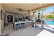 Outdoor kitchen with pizza oven and bar seating at 3749 E Juniper Cir, Mesa, AZ 85205