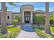 Elegant home entrance with stone and columns at 3749 E Juniper Cir, Mesa, AZ 85205