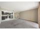 Open living room with view of kitchen at 7920 E Camelback Rd # 206, Scottsdale, AZ 85251