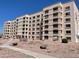 Exterior view of an apartment building with landscaping at 7920 E Camelback Rd # 206, Scottsdale, AZ 85251