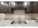 Modern kitchen sink with granite countertop at 7920 E Camelback Rd # 206, Scottsdale, AZ 85251