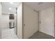Bright entryway with view of kitchen and closet at 7920 E Camelback Rd # 206, Scottsdale, AZ 85251