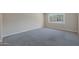 Bright bedroom with carpet flooring and a large window with a view at 7920 E Camelback Rd # 206, Scottsdale, AZ 85251