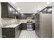 Modern kitchen with granite counters and stainless steel appliances at 7920 E Camelback Rd # 206, Scottsdale, AZ 85251