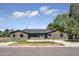 Brick house with a modern design and large windows at 1426 W Royal Palm Rd, Phoenix, AZ 85021