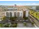 Aerial view of a modern apartment building with city views and ample parking at 1130 N 2Nd St # 409, Phoenix, AZ 85004