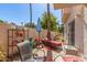 Private patio with seating and a colorful rug at 1301 W Coral Reef Dr, Gilbert, AZ 85233