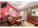 Spacious bedroom with wood furniture and a large window at 1301 W Coral Reef Dr, Gilbert, AZ 85233