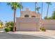 Two-story stucco home with attached garage and desert landscaping at 1301 W Coral Reef Dr, Gilbert, AZ 85233