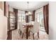 Bright dining area with hardwood floors and a view to the kitchen at 1301 W Coral Reef Dr, Gilbert, AZ 85233