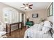 Small bedroom with white daybed and arched window at 1301 W Coral Reef Dr, Gilbert, AZ 85233