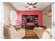 Cozy Gathering room with built-in shelving and a vibrant accent wall at 1301 W Coral Reef Dr, Gilbert, AZ 85233