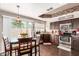 Modern kitchen with dark wood cabinets and stainless steel appliances at 1301 W Coral Reef Dr, Gilbert, AZ 85233