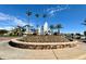 Community fountain with palm trees and lake view at 1301 W Coral Reef Dr, Gilbert, AZ 85233