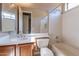 Clean bathroom with a bathtub and wood vanity at 17724 W Ocotillo Ave, Goodyear, AZ 85338