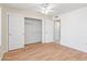 Bedroom with double door closet and view into adjacent bathroom at 14709 W Greystone Dr, Sun City West, AZ 85375