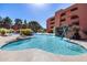 Resort-style pool with a relaxing waterfall feature at 4303 E Cactus Rd # 441, Phoenix, AZ 85032
