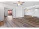 Living room with wood-look floors and access to another room at 4303 E Cactus Rd # 441, Phoenix, AZ 85032