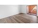 Bright bedroom with laminate flooring and access to a private balcony at 4303 E Cactus Rd # 441, Phoenix, AZ 85032