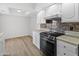 Clean kitchen with white cabinets and new appliances at 4303 E Cactus Rd # 441, Phoenix, AZ 85032