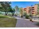 Brick pathway winds through landscaped grounds at 4303 E Cactus Rd # 441, Phoenix, AZ 85032