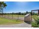 Landscaped entrance with gate and rock feature at 4303 E Cactus Rd # 441, Phoenix, AZ 85032