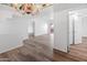 Spacious living room with hardwood floors and chandelier at 4303 E Cactus Rd # 441, Phoenix, AZ 85032