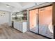 Modern kitchen with white cabinets and access to patio at 4303 E Cactus Rd # 441, Phoenix, AZ 85032