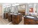 Double vanity bathroom with dark wood cabinets and granite countertops at 4303 E Cactus Rd # 441, Phoenix, AZ 85032