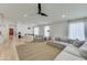 Spacious living area with light hardwood floors and a cozy seating arrangement at 35925 N 30Th Dr, Phoenix, AZ 85086