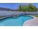 Inviting kidney shaped pool with a rock waterfall at 35925 N 30Th Dr, Phoenix, AZ 85086