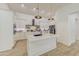Modern kitchen with white cabinets, large island and stainless steel appliances at 35925 N 30Th Dr, Phoenix, AZ 85086