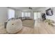 Playroom with large sectional sofa and light wood floors at 35925 N 30Th Dr, Phoenix, AZ 85086