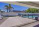 Covered patio, sparkling pool, and grassy area with fire pit at 35925 N 30Th Dr, Phoenix, AZ 85086