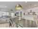 Open concept dining area with a large dark wood table and modern chairs at 35925 N 30Th Dr, Phoenix, AZ 85086