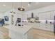 Modern kitchen with white cabinets, large island and stainless steel appliances at 35925 N 30Th Dr, Phoenix, AZ 85086