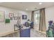 Home office with desk, chair and ample natural light at 35925 N 30Th Dr, Phoenix, AZ 85086