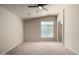 Bright bedroom with carpet, ceiling fan, and arched doorway at 2150 W Alameda Rd # 1273, Phoenix, AZ 85085