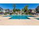 Community pool with lounge chairs and shaded seating areas at 2150 W Alameda Rd # 1273, Phoenix, AZ 85085