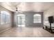 Spacious living room with tile floors, ceiling fan, and sliding glass door at 2150 W Alameda Rd # 1273, Phoenix, AZ 85085