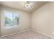 Well-lit bedroom with window and ceiling fan at 2150 W Alameda Rd # 1273, Phoenix, AZ 85085